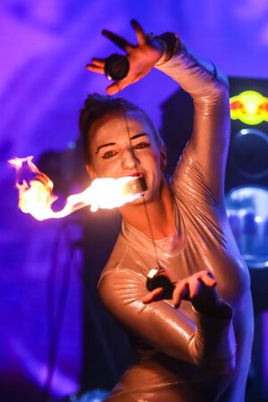 Brezje, Croatia - 19th July, 2019 : A woman juggling with a fire on the stage on the Forestland,...