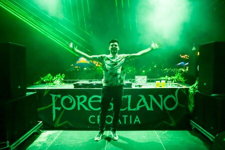 Brezje, Croatia - 20th July, 2019 : Dj Milos Stankic performs on the Forestland, ultimate forest electronic music festival located in Brezje, Croatia.のeditorial素材