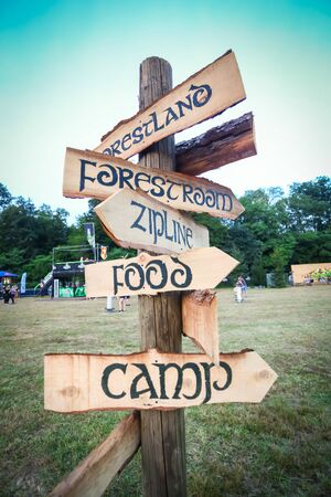 Brezje, Croatia - 20th July, 2019 : Wooden signs with different directions on the Forestland,...