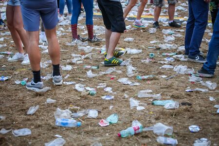 Brezje, Croatia - 20th July, 2019 : Detail of plastic cups and garbage on the floor after whole...