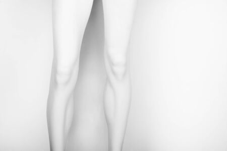 Close up of female mannequin legs isolated on white background.の写真素材