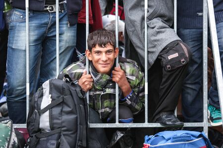 Bregana, Slovenia - September 20, 2015 : Male syrian refugees at the slovenian border with Croatia....