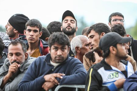 Bregana, Slovenia - September 20, 2015 : A group of male syrian refugees at the slovenian border...