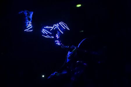 Zagreb, Croatia - December 28, 2019 : FMX motorbike driver performing with led lights in a fluorescent light ambience on the Masters of Dirt Total Freestyle Tour 2019 - Freestyle motocross show.のeditorial素材