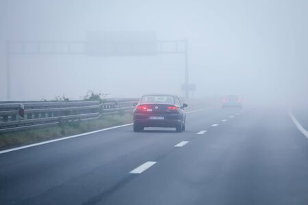 Zagreb, Croatia - 27th October, 2019 : Traffic on the highway during thick morning fog.のeditorial素材