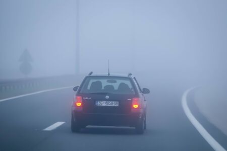 Zagreb, Croatia - 27th October, 2019 : Traffic on the highway during thick morning fog.のeditorial素材