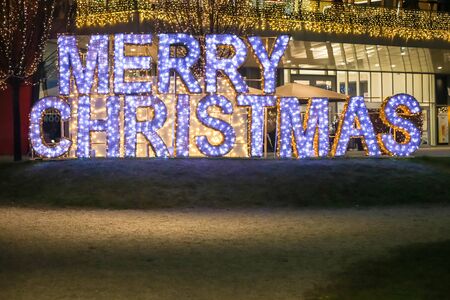 Zagreb, Croatia - December 28, 2019 : A big illuminated sign Merry Christmas in front of shopping mall Arena Zagreb in Zagreb, Croatia.のeditorial素材
