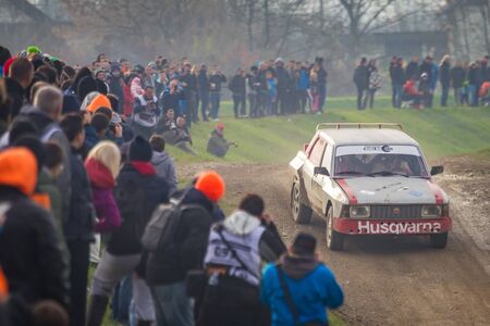 Sveta Nedjelja, Croatia - November 24, 2019. 10th Rally Show Santa Domenica. Marin Nezic and Stefano Basaneze in Fiat Argenta V6 with spectators at the jump section of the track.のeditorial素材