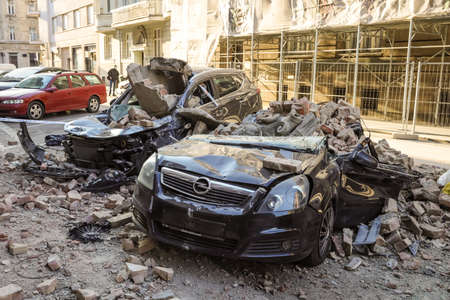 Zagreb, Croatia - March 22, 2020 : In the morning capital of Croatia, Zagreb has been hit by the magnitude of the earthquake 5.5 per Richter. Cars have been destroyed by fallen parts of the building.のeditorial素材