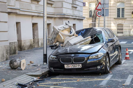Zagreb, Croatia - March 22, 2020 : In the morning capital of Croatia, Zagreb has been hit by the magnitude of the earthquake 5.5 per Richter. Cars have been destroyed by fallen parts of the building.のeditorial素材