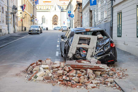 Zagreb, Croatia - March 22, 2020 : In the morning capital of Croatia, Zagreb has been hit by the magnitude of the earthquake 5.5 per Richter. Cars have been destroyed by fallen parts of the building.のeditorial素材