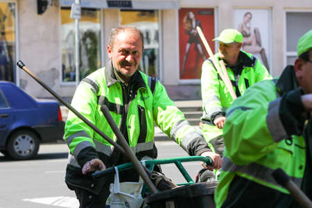 Zagreb, Croatia - April 17, 2020 : A group of garbage man driving bikes with trash cans on it in downtown of Zagreb, Croatia.のeditorial素材
