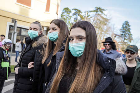 Velika Gorica, Croatia - February 22, 2020 : Carnival parade passes on the main street of Velika Gorica, during Turopoljski Carnival. People dressed on the topic of coronavirus.のeditorial素材