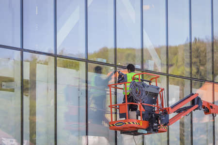Zagreb, Croatia - 16 April, 2020 : Workers working on the construction site of the new building for cable car that goes to the top of the Medvednica Nature Park in Zagreb, Croatia.のeditorial素材