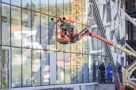Zagreb, Croatia - 16 April, 2020 : Workers working on the construction site of the new building for cable car that goes to the top of the Medvednica Nature Park in Zagreb, Croatia.のeditorial素材