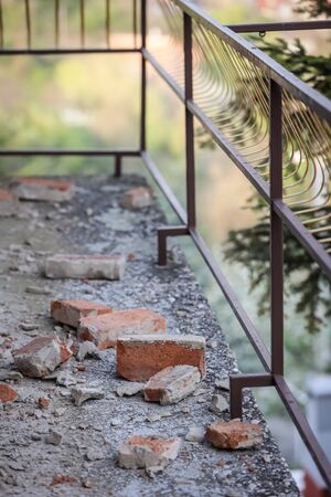 Scattered and damaged bricks on the balcony of the house after a strong earthquake of 5.5 on the Richter scale one month ago in Zagreb, Croatiaの写真素材
