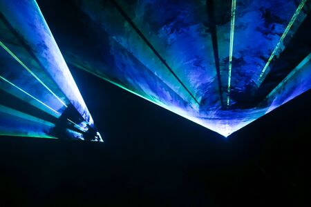 Colorful laser and stage lights isolated on black, laser show.
