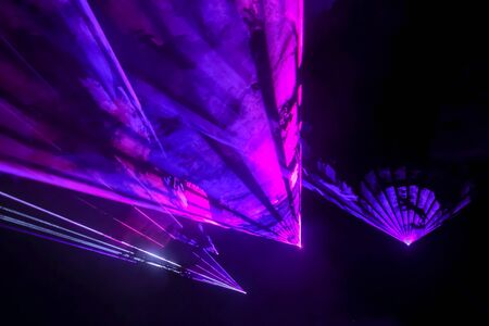Colorful laser and stage lights isolated on black, laser show.