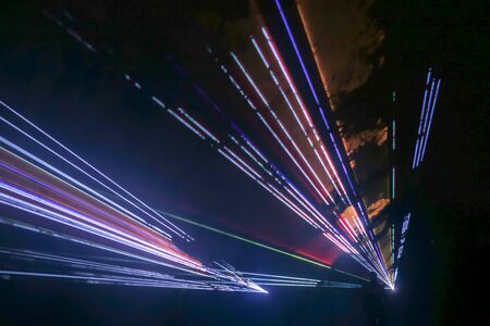 Colorful laser and stage lights isolated on black, laser show.