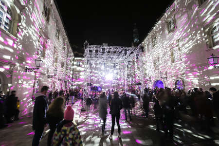Zagreb, Croatia - 16 March, 2018 : People watching the building of Klovicevi dvori Gallery illuminated by the disco ball lights in the center of Zagreb.のeditorial素材