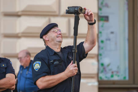 Zagreb, Croatia - 14. September, 2018 : Police recording video of the protests against the ruling political party Hdz and the opposition SDP on Ban Jelacic Square in Zagreb, Croatia.のeditorial素材