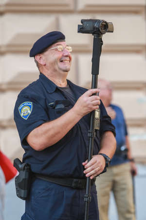 Zagreb, Croatia - 14. September, 2018 : Police recording video of the protests against the ruling political party Hdz and the opposition SDP on Ban Jelacic Square in Zagreb, Croatia.のeditorial素材