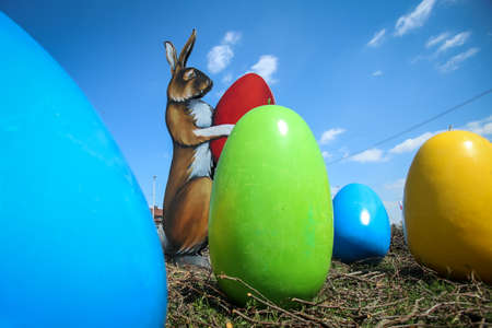 Velika Gorica, Croatia - 21 April, 2017 : A sculpture of a rabbit holding an Easter egg in its paws and surrounded by Easter eggs on the streets of Velika Gorica during Easter time.のeditorial素材