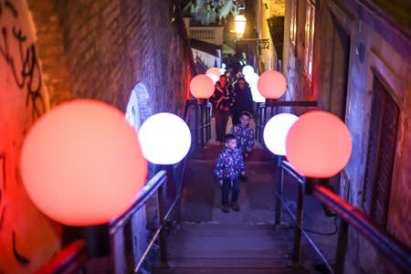 Zagreb, Croatia - 19 March, 2017 : Festival of lights in Zagreb, Croatia. People on the stairs to the upper town with installed color ball lamps, next to the funicular in the center of Zagreb.のeditorial素材