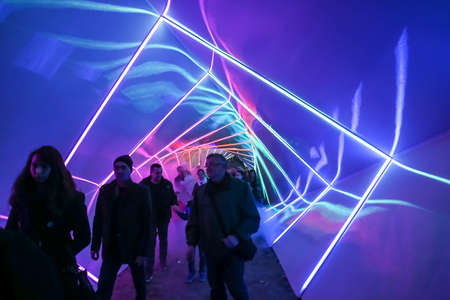 Zagreb, Croatia - 19 March, 2017 : Festival of lights in Zagreb, Croatia. People walking through a lighted tunnel installation with colorful neon lights in the center of Zagreb.のeditorial素材