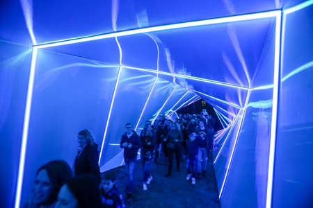 Zagreb, Croatia - 19 March, 2017 : Festival of lights in Zagreb, Croatia. People walking through a lighted tunnel installation with colorful neon lights in the center of Zagreb.のeditorial素材
