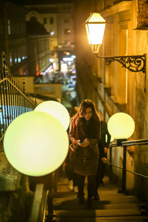 Zagreb, Croatia - 19 March, 2017 : Festival of lights in Zagreb, Croatia. People on the stairs to the upper town with installed color ball lamps, next to the funicular in the center of Zagreb.のeditorial素材
