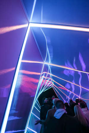 Zagreb, Croatia - 19 March, 2017 : Festival of lights in Zagreb, Croatia. People walking through a lighted tunnel installation with colorful neon lights in the center of Zagreb.のeditorial素材