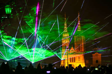 Zagreb, Croatia - 19 March, 2017 : Festival of lights in Zagreb, Croatia. People watch a laser show near Klovicevi dvori in the upper town with a view of the Zagreb Cathedral.のeditorial素材
