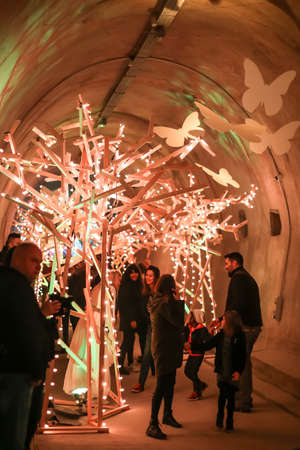 Zagreb, Croatia - 19 March, 2017 : Festival of lights in Zagreb, Croatia. People walking through a lighted tunnel Gric with lighted colorful wood shaped sculpture in the center of Zagreb.のeditorial素材