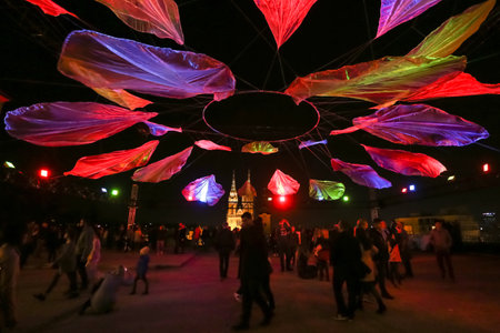 Zagreb, Croatia - 24 March, 2019 : Festival of lights in Zagreb. People standing under lighting installations on a plateau of Klovicevi palaces in the upper town with a view of the Zagreb Cathedral.のeditorial素材