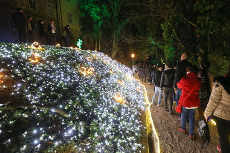 Zagreb, Croatia - 24 March, 2018 : People walking on illuminated park like flowers in a Vrazs promenade in upper town of Zagreb.のeditorial素材