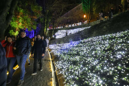 Zagreb, Croatia - 24 March, 2018 : People walking on illuminated park like flowers in a Vrazs promenade in upper town of Zagreb.のeditorial素材