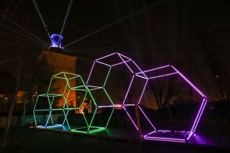Zagreb, Croatia - 24 March, 2019 : Festival of lights in Zagreb, Croatia. Illuminated hexagons of construction stacked on top of each other in upper town.のeditorial素材