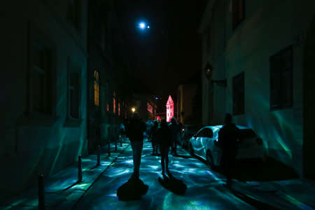 Zagreb, Croatia - 24 March, 2019 : Festival of lights in Zagreb, Croatia. People walk down a lighted street in the upper town during the night.のeditorial素材