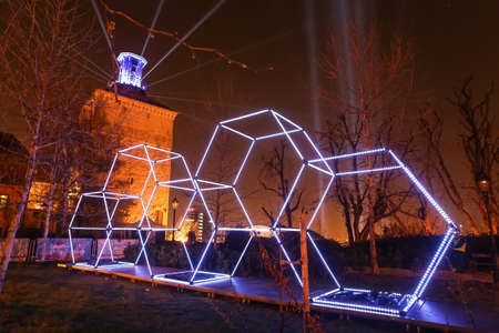 Zagreb, Croatia - 24 March, 2019 : Festival of lights in Zagreb, Croatia. Illuminated hexagons of construction stacked on top of each other in upper town.のeditorial素材