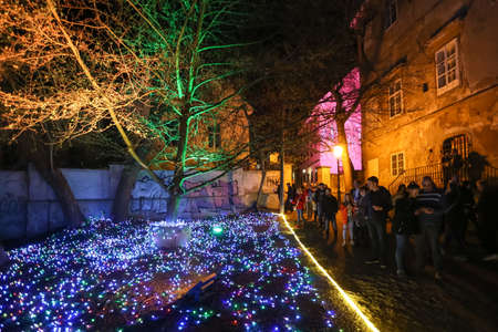 Zagreb, Croatia - 24 March, 2018 : People walking on illuminated park like flowers in a Vrazs promenade in upper town of Zagreb.のeditorial素材