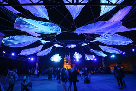 Zagreb, Croatia - 24 March, 2019 : Festival of lights in Zagreb. People standing under lighting installations on a plateau of Klovicevi palaces in the upper town with a view of the Zagreb Cathedral.のeditorial素材
