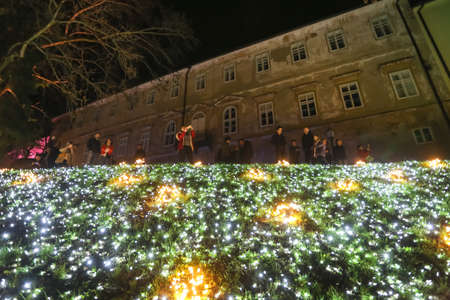 Zagreb, Croatia - 24 March, 2018 : People walking on illuminated park like flowers in a Vrazs promenade in upper town of Zagreb.のeditorial素材
