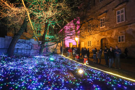 Zagreb, Croatia - 24 March, 2018 : People walking on illuminated park like flowers in a Vrazs promenade in upper town of Zagreb.のeditorial素材