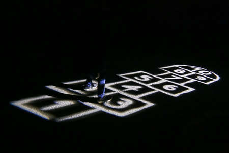Illuminated playing field for hopscotch game during the night.の写真素材
