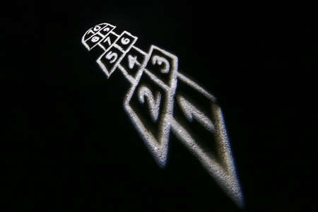 Illuminated playing field for hopscotch game during the night.の写真素材