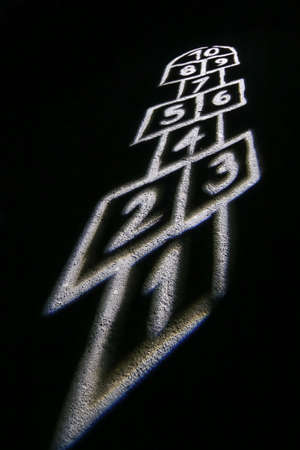 Illuminated playing field for hopscotch game during the night.の写真素材
