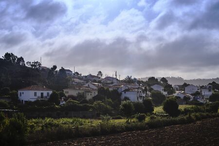 he village of Odeceixe in the morning light.. Solo Backpacker Trekking on the Rota Vicentina and Fishermen's Trail in Algarve, Portugal. Walking between cliff, ocean, nature and beach.の写真素材
