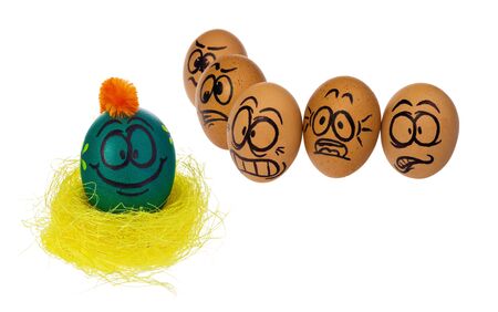 Easter eggs, hand-made painted in various patterns and colors with cartoon faces. Eggs in natural...