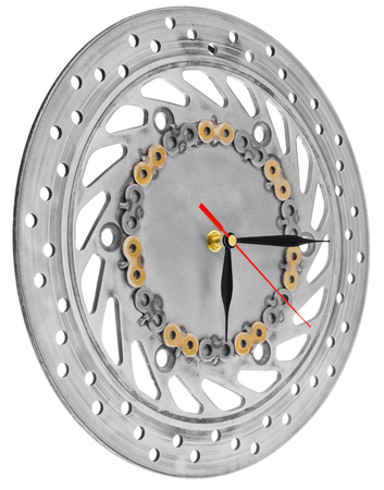 Handmade clock made of motorcycle parts. A clock face made of a brake disc decorated with hand-painted chain parts. Artistic object on a white background.の写真素材
